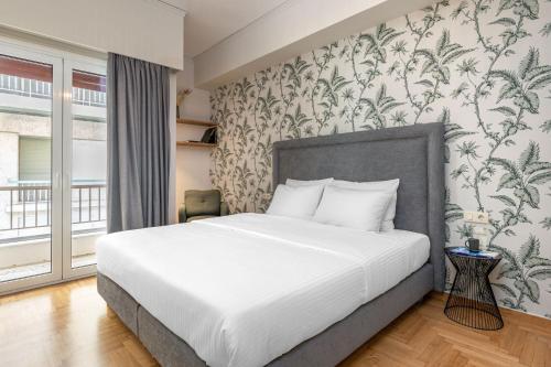 Posteľ alebo postele v izbe v ubytovaní The Beehive Apartments