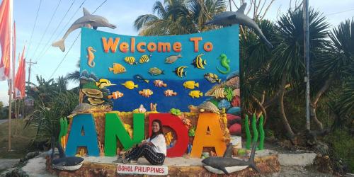 a welcome to amazon sign in front of a cake at Anda Poseidon’s Beach Resort in Anda