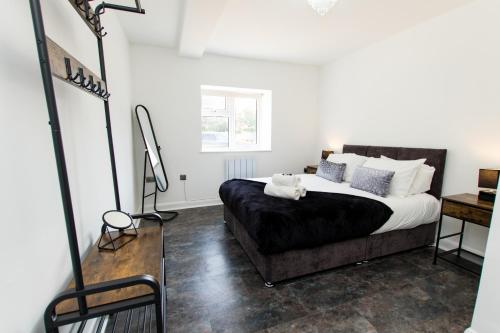 Ένα ή περισσότερα κρεβάτια σε δωμάτιο στο K Suites - Flat 114 Fulbridge Road