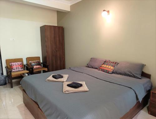 Ein Bett oder Betten in einem Zimmer der Unterkunft Kanvas Suites - Sun N Moon