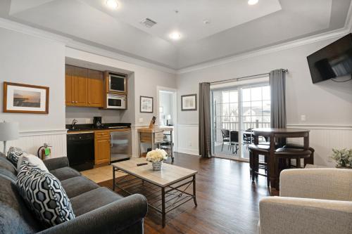 a living room with a couch and a table at The Cliffside Resort Condominiums in Greenport