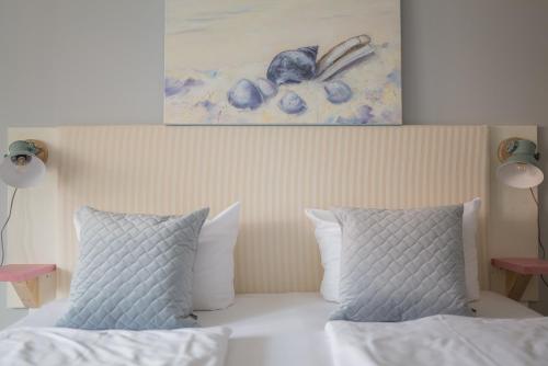 Hotel 'Das Strandhaus'にあるベッド