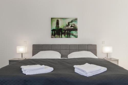 Postel nebo postele na pokoji v ubytování LIGHTHOUSE APPARTEMENTS
