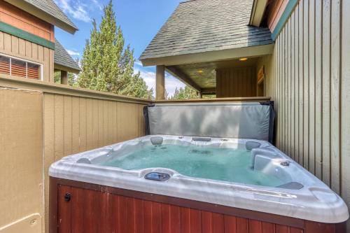 a hot tub on the side of a house at Eagle Crest Family Friendly Chalet in Redmond