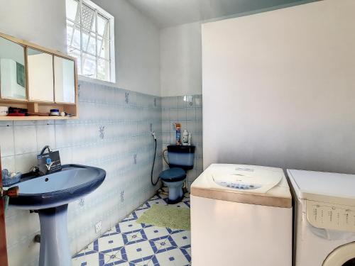 a bathroom with a sink and a toilet at villa beeharry in Calodyne
