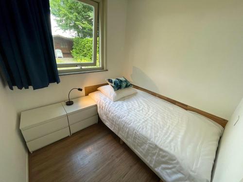 Postel nebo postele na pokoji v ubytování Vakantiebungalow Deltona