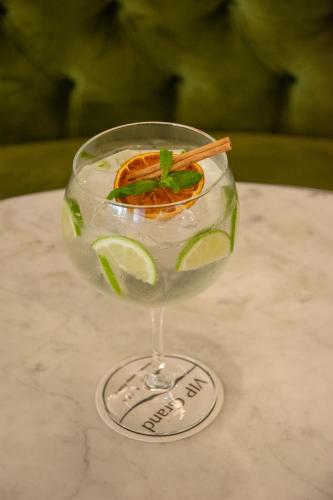 a wine glass with a drink on a table at VIP Grand Lisboa Hotel & Spa in Lisbon