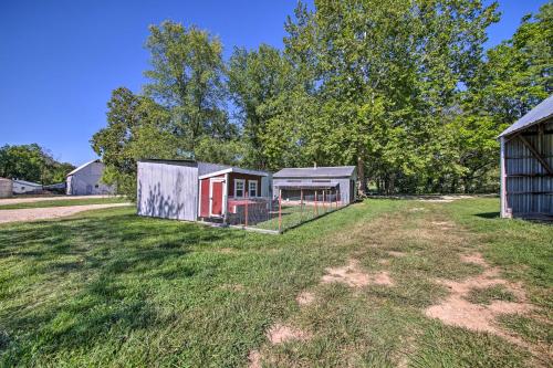 an image of a yard with two buildings at Peaceful Guest Home with Patio on 152-Acre Farm in Berger