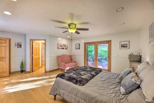 a bedroom with a bed and a ceiling fan at Majestic Caldwell Retreat with Wraparound Deck! in Caldwell
