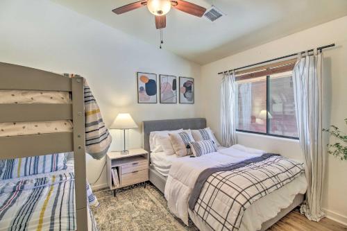 a bedroom with two beds and a ceiling fan at Game Room and Private Dock Lakeside Cabin! in Lake of the Woods