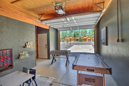a room with a ping pong table in a house at Game Room and Private Dock Lakeside Cabin! in Lake of the Woods