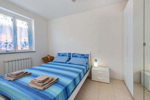 Posteľ alebo postele v izbe v ubytovaní Apartment with Terrace & Parking near the Sea