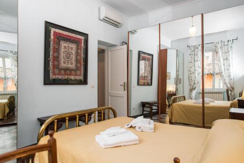 Holidays Banchi Vecchi Apartment tesisinde bir odada yatak veya yataklar