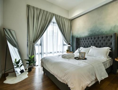 a bedroom with a large bed and a large window at Majestic Apartment KLCC in Kuala Lumpur