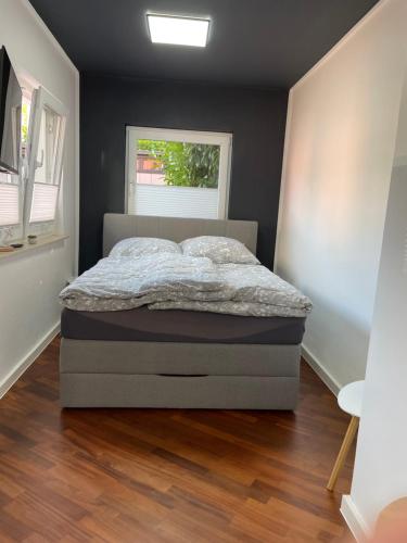 a bedroom with a bed and a window at Studio in Wilhelmshaven