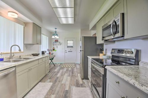 a kitchen with a sink and a stove top oven at Pool Access Ranch-Style House in Sun City Center in Sun City Center