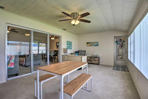 a dining room with a table and a ceiling fan at Pool Access Ranch-Style House in Sun City Center in Sun City Center