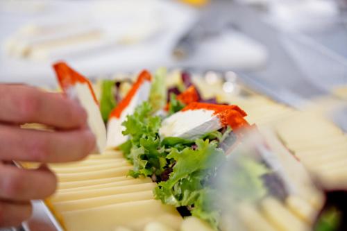a person is holding a plate of food at Luma Terra Prague Hostel in Prague