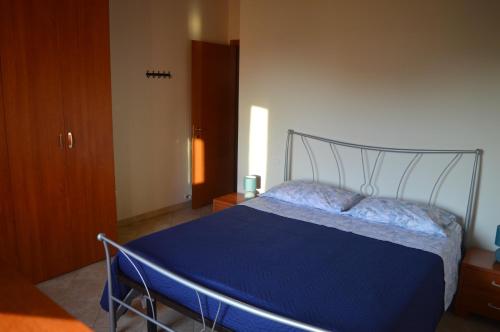 Een bed of bedden in een kamer bij Casa AmeRosa
