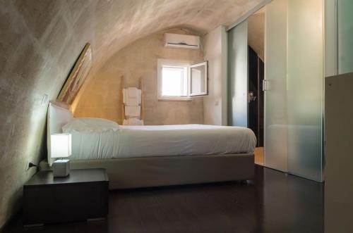 Postel nebo postele na pokoji v ubytování La Scala Suite