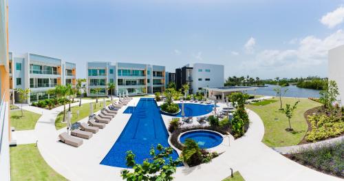 an image of a resort with a swimming pool at ONE Canal Point in Upper Land