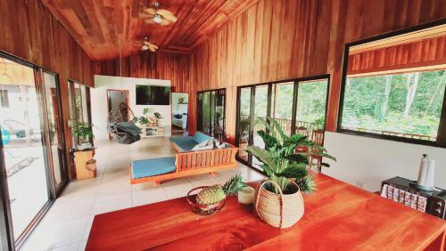 a living room with a couch and a table at Villa Cocos la Fortuna in Fortuna
