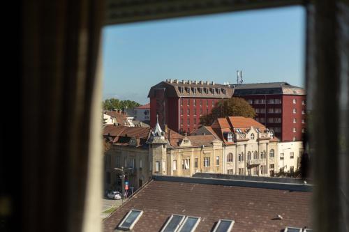 a view of a city from a window at Suflat Apartman Studio in Subotica