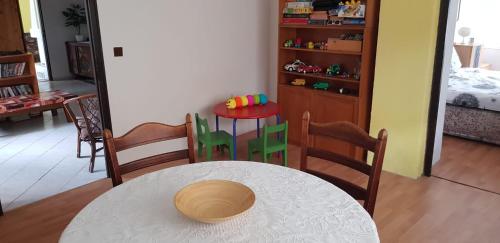 a room with a table and chairs and a room with a bedroom at Chalupa Venda in Kraslice