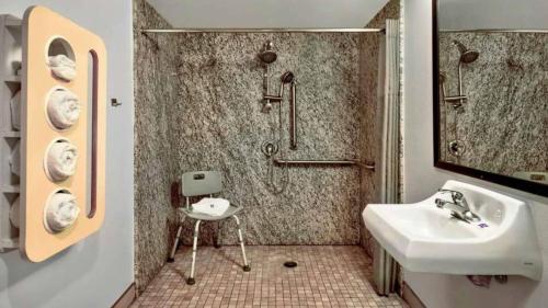 a bathroom with a shower and a sink at Studio 6 Victorville - Apple Valley in Victorville