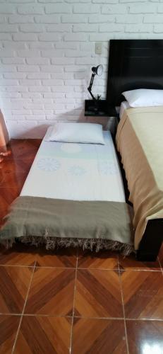 Una cama o camas en una habitación de Cálida suite en Liguiqui - Manta