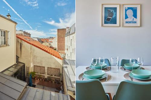 une table sur un balcon avec vue sur une ville dans l'établissement Residence Boulogne Centre le passage by Studio prestige, à Boulogne-Billancourt
