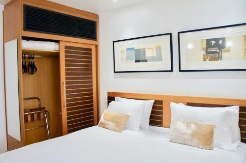 Posteľ alebo postele v izbe v ubytovaní Flat Whynd Paulista Al Campinas 540