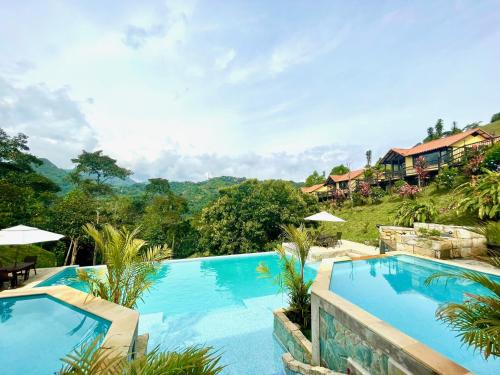 a swimming pool with a view of a resort at LoMar Sol&Luna in Sasaima