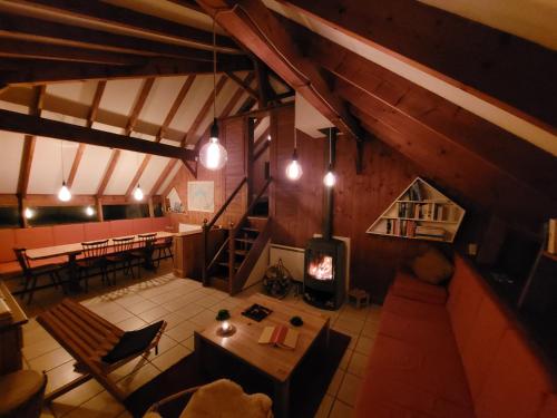 an overhead view of a living room with a wood stove at Chalet Chalon in Meillerie