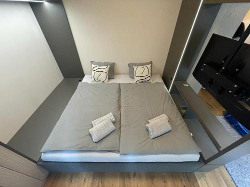Ein Bett oder Betten in einem Zimmer der Unterkunft Nový Trio Harrachov apartmán