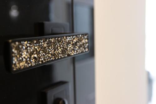 a close up of a door with gold lights on it at Apartament LUNA, Piotrkowska 44 - free parking in Łódź