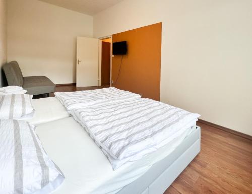 Un ou plusieurs lits dans un hébergement de l'établissement Bezaubernde Wohnung in zentraler Lage