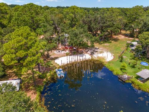 an aerial view of a park with a lake and trees at Family Forest Retreat, Paradise at Point Pleasant! in Salt Springs