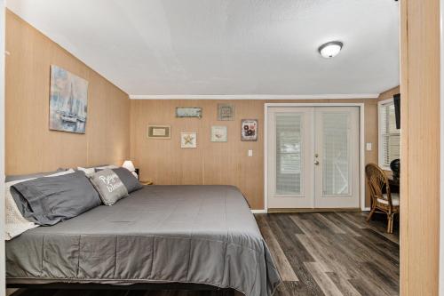 a bedroom with a large bed in a room at Family Forest Retreat, Paradise at Point Pleasant! in Salt Springs