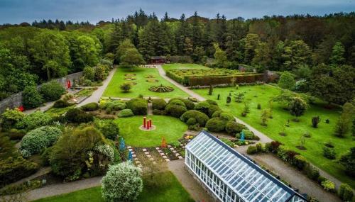 an overhead view of a garden with a greenhouse at Zoe Bistro & Accommodation in Kilrush