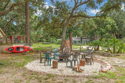 a group of chairs and tables in a park at Family Forest Retreat, Paradise at Point Pleasant! in Salt Springs