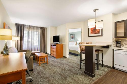 a hotel suite with a living room and a bedroom at Sonesta ES Suites San Diego - Rancho Bernardo in Rancho Bernardo