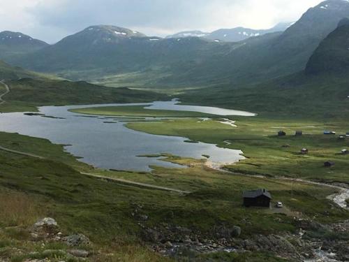 a large body of water in a valley with mountains at Stalheim Fjord og Fjellhytter in Stalheim