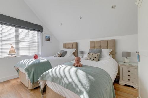 a bedroom with two beds with teddy bears on them at Sea Vista in Carbis Bay