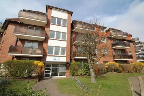 an apartment building with balconies on the side of it at Residenz Passat Cuxhaven 4 in Cuxhaven