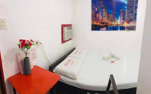 Ένα ή περισσότερα κρεβάτια σε δωμάτιο στο WJV INN CAR-CAR BRANCH