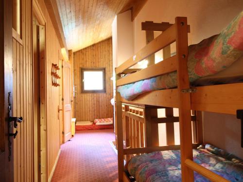 a bedroom with two bunk beds in a cabin at Appartement Les Carroz d'Arâches, 4 pièces, 8 personnes - FR-1-572-127 in Arâches-la-Frasse