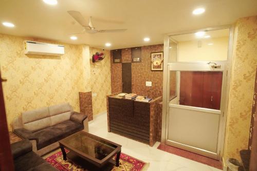 a living room with a couch and a chair at Anand Kanan in Varanasi