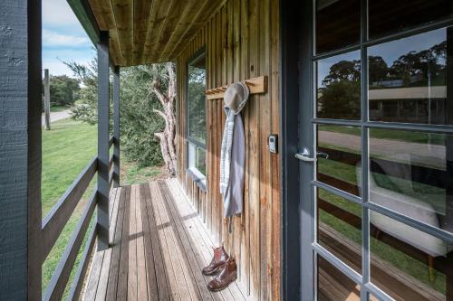 a wooden door with a tie hanging on it at The Ranch Mornington Peninsula in Boneo