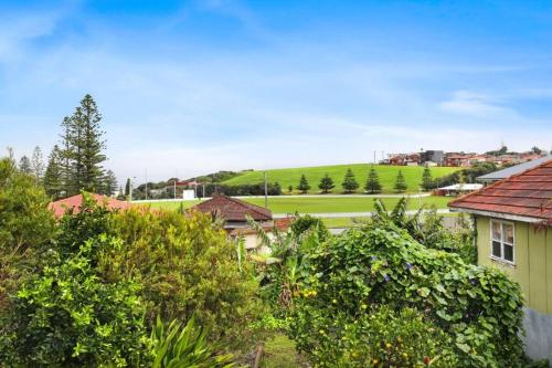 a view of a town with houses and trees at Beautiful 4-bedroom original beach cottage in Port Kembla in Port Kembla